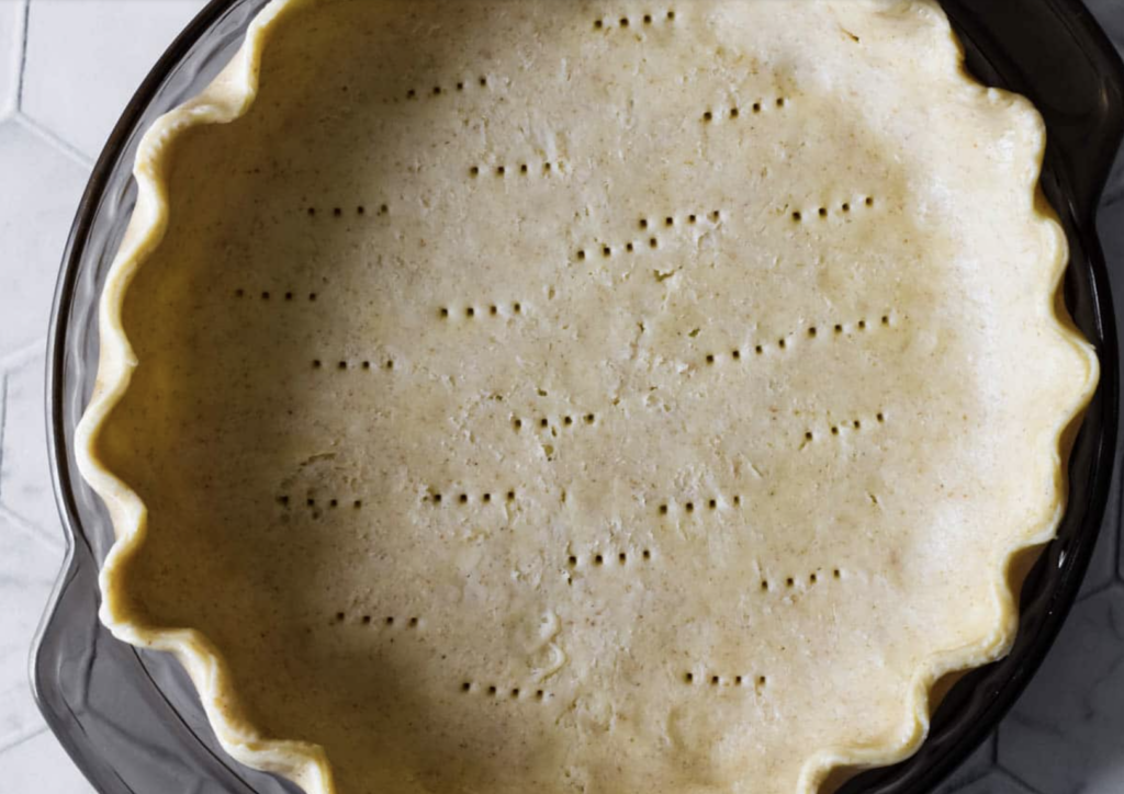 Easy sourdough pie crust made with sourdough starter discard. Fork print holes in bottom of pie crust right before baking in the oven.